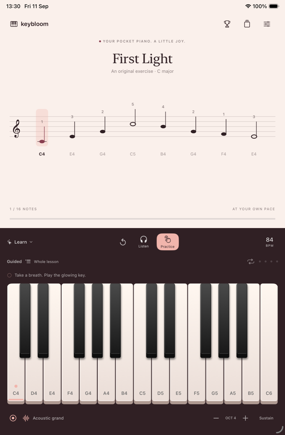 Keybloom on iPad with the Sunset theme, sheet music and piano keyboard